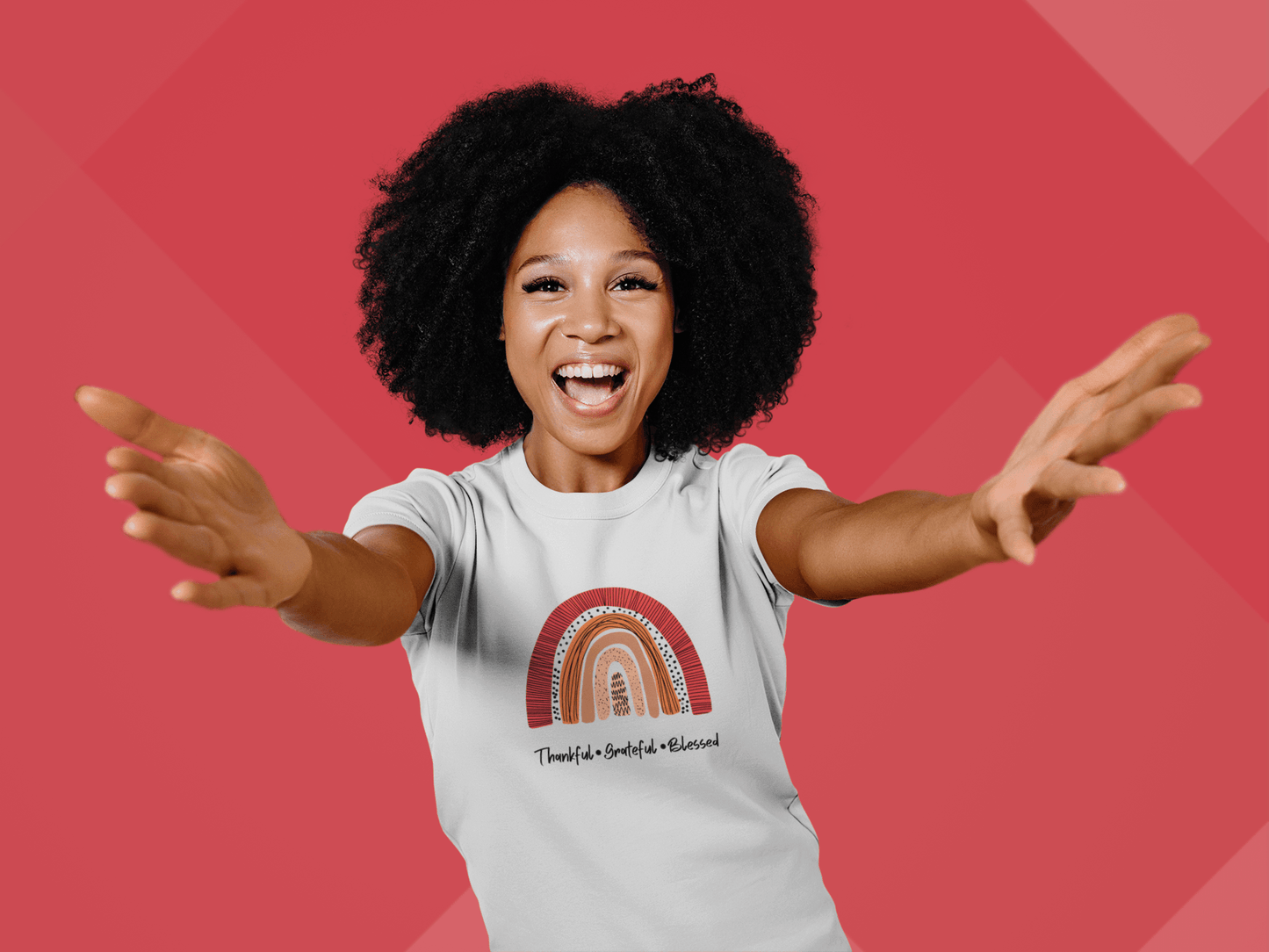 A young woman wearing a Thankful, Grateful, Blessed Tee by Sharp Tact Kreativ | Tees & Gifts with Encouraging Messages to Brighten Your Day with a Bit of Wit, feeling grateful.