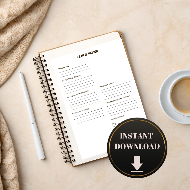 The Year in Review Journal Page by Sharp Tact Kreativ is open on marble with a pen, coffee cup, and beige blanket. An “Instant Download” badge appears in the corner—by Sharp Tact Kreativ: Encouraging, witty gifts to brighten your day.