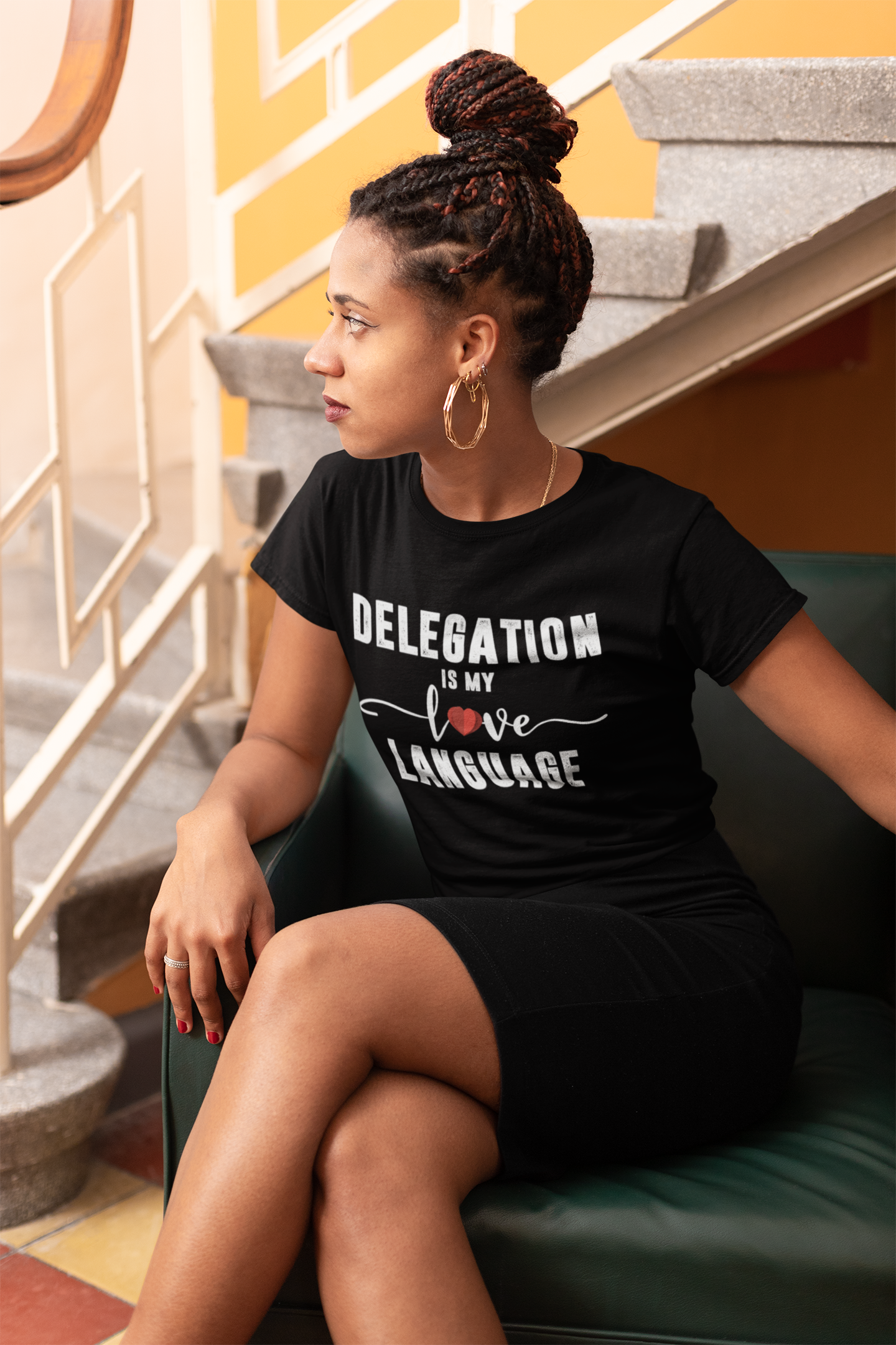 A woman wearing a black Delegation is My Love Language Tee from Sharp Tact Kreativ | Tees & Gifts with Encouraging Messages to Brighten Your Day with a Bit of Wit.