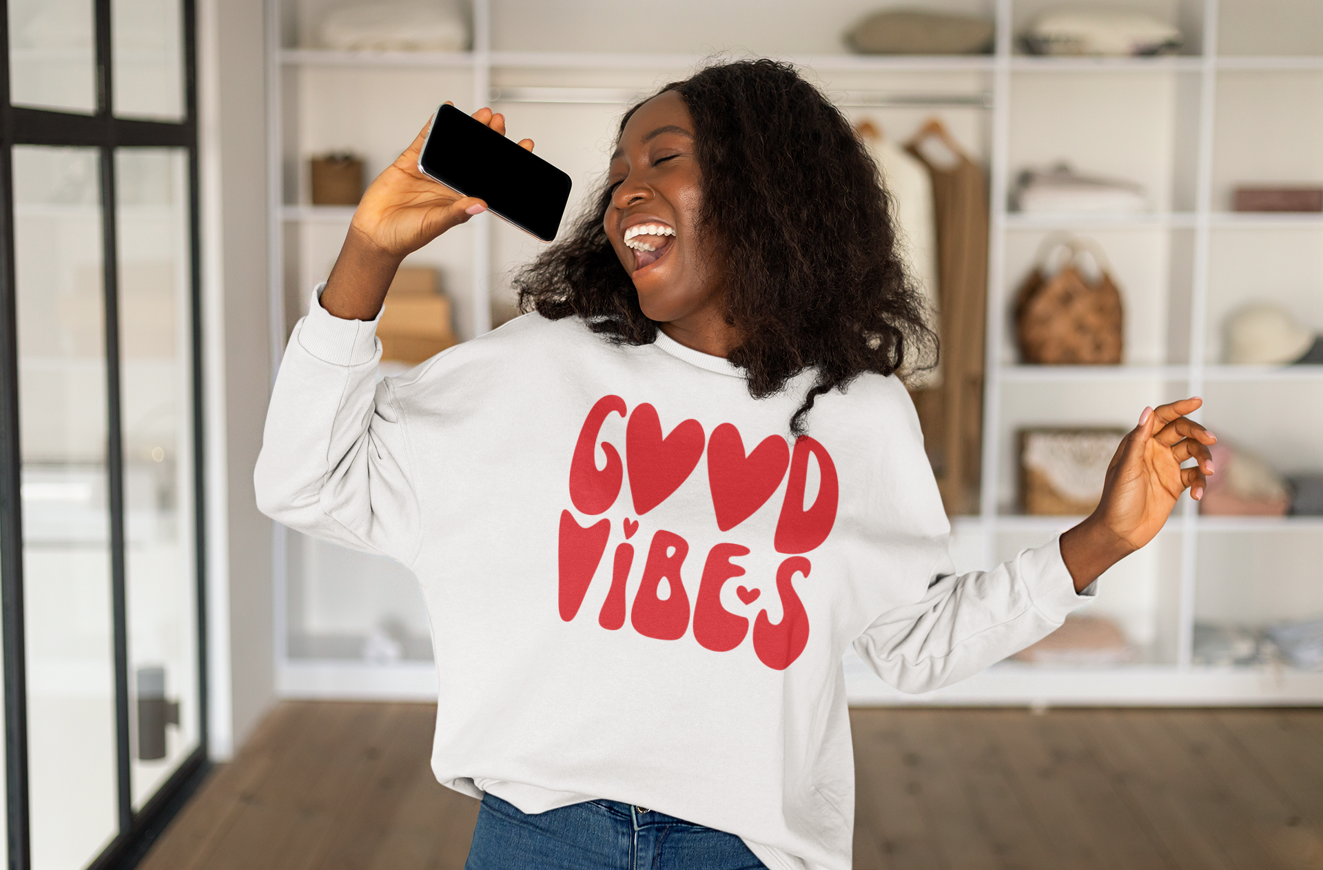 A woman wearing a Good Vibes Red Sweatshirt from Sharp Tact Kreativ, made from a cotton and polyester blend.