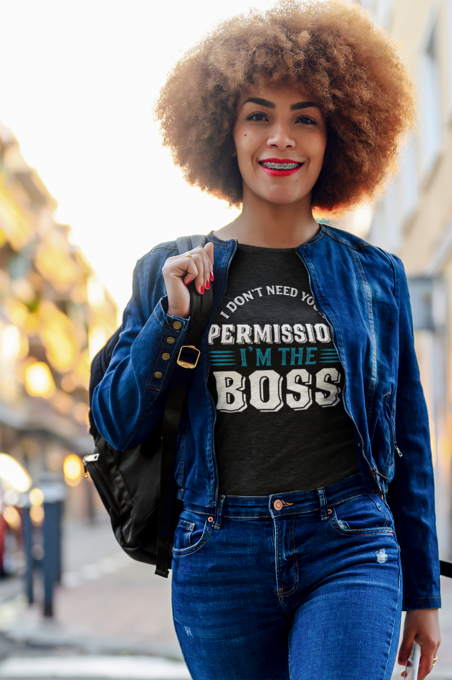 A woman wearing jeans and a I Don't Need Permission Tee by Sharp Tact Kreativ | Tees & Gifts with Encouraging Messages to Brighten Your Day with a Bit of Wit t - shirt that says i'm the boss.